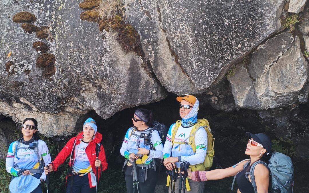 a group of climbers hiking Kilimanjaro with backpacks and poles